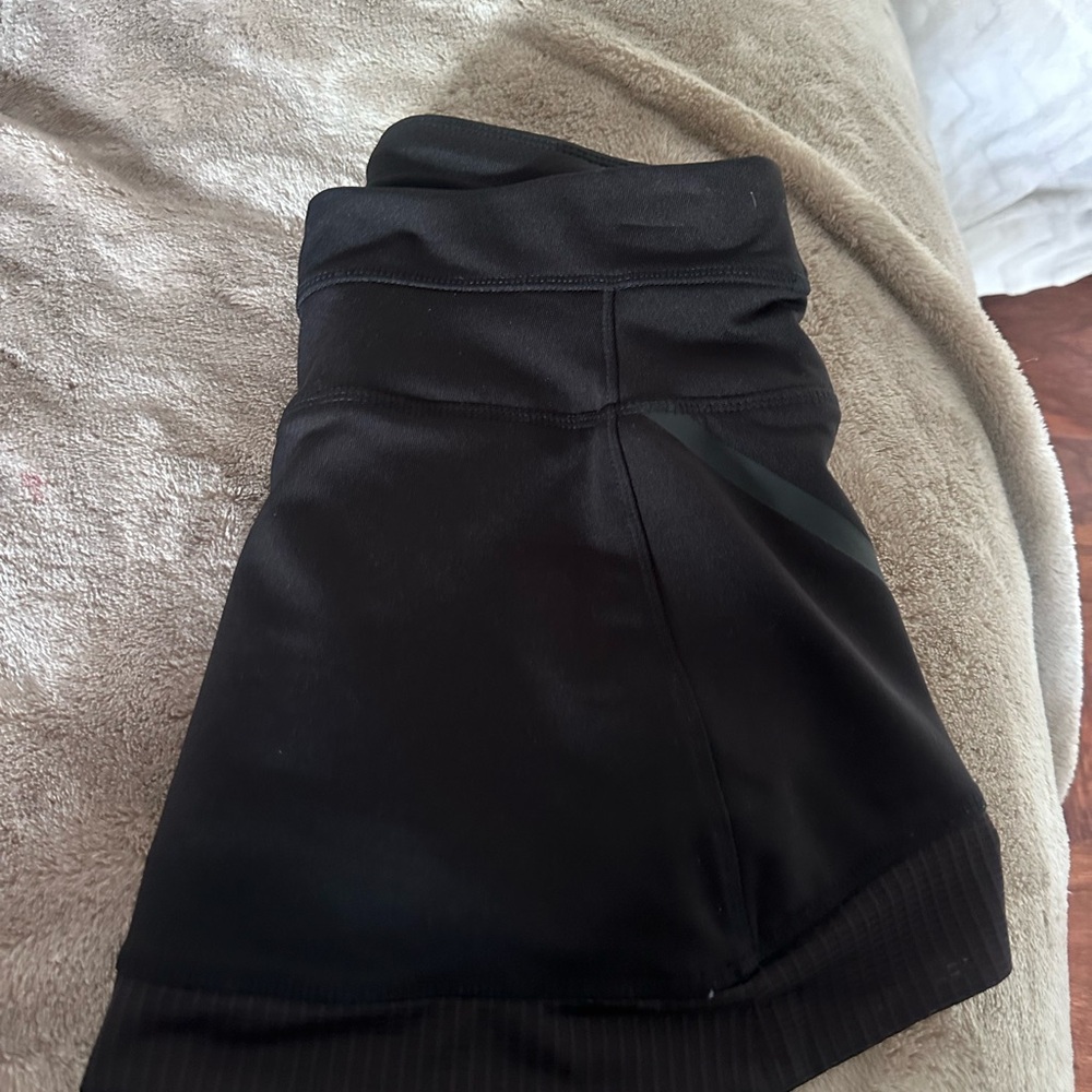 Athleta black tennis mini skirt with built in shorts.